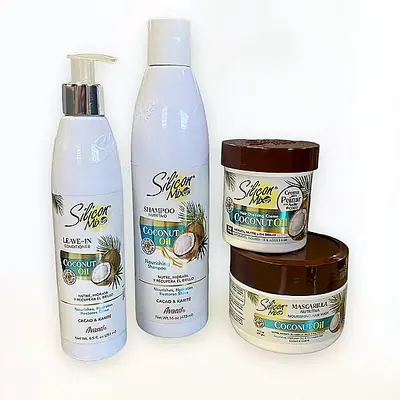 Productos capilares con aceite de coco en envases blancos